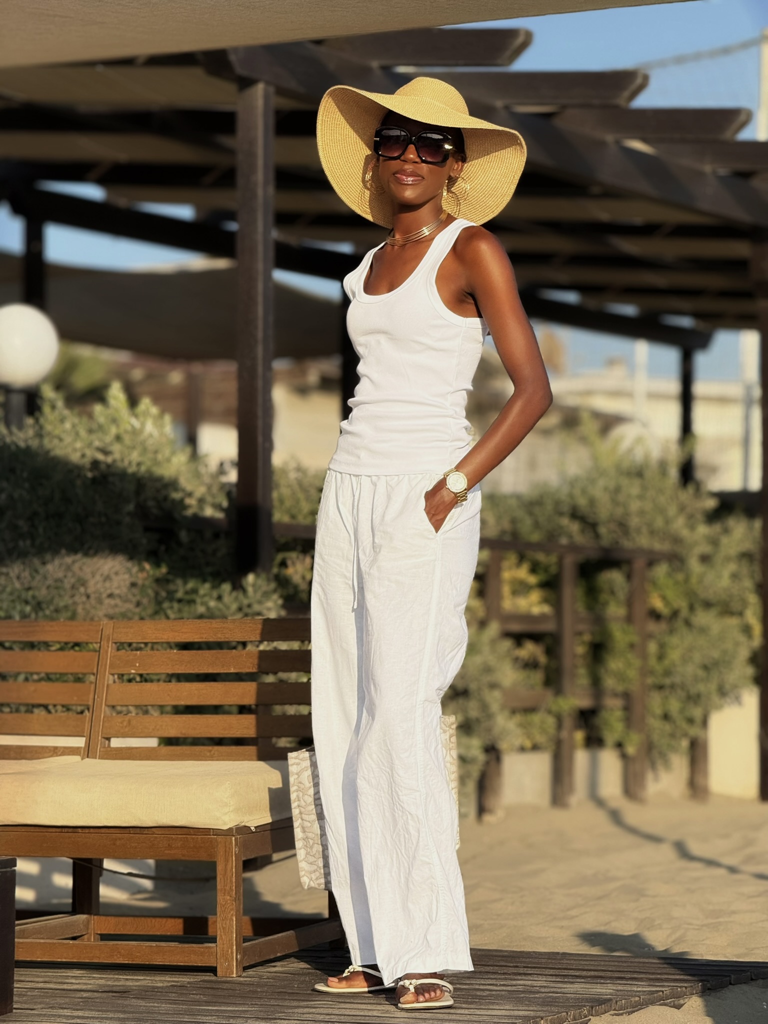 linen pants and ribbed tank outfit for drinks by the beach